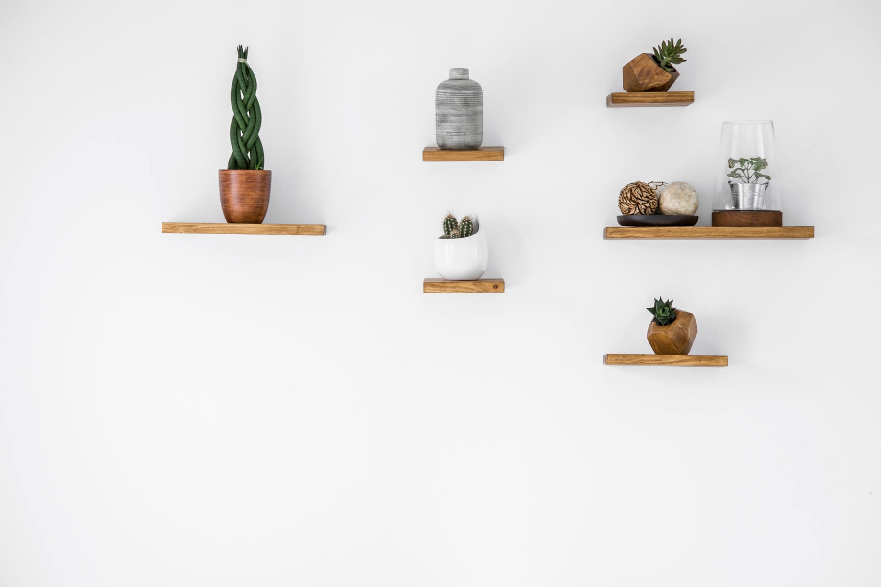 Plants and vases on floating shelves