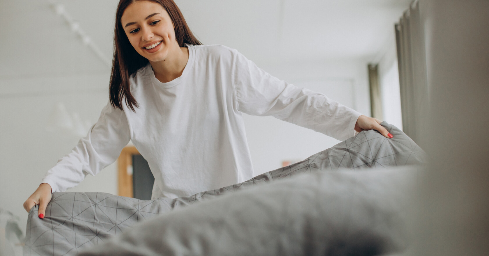 woman making bed