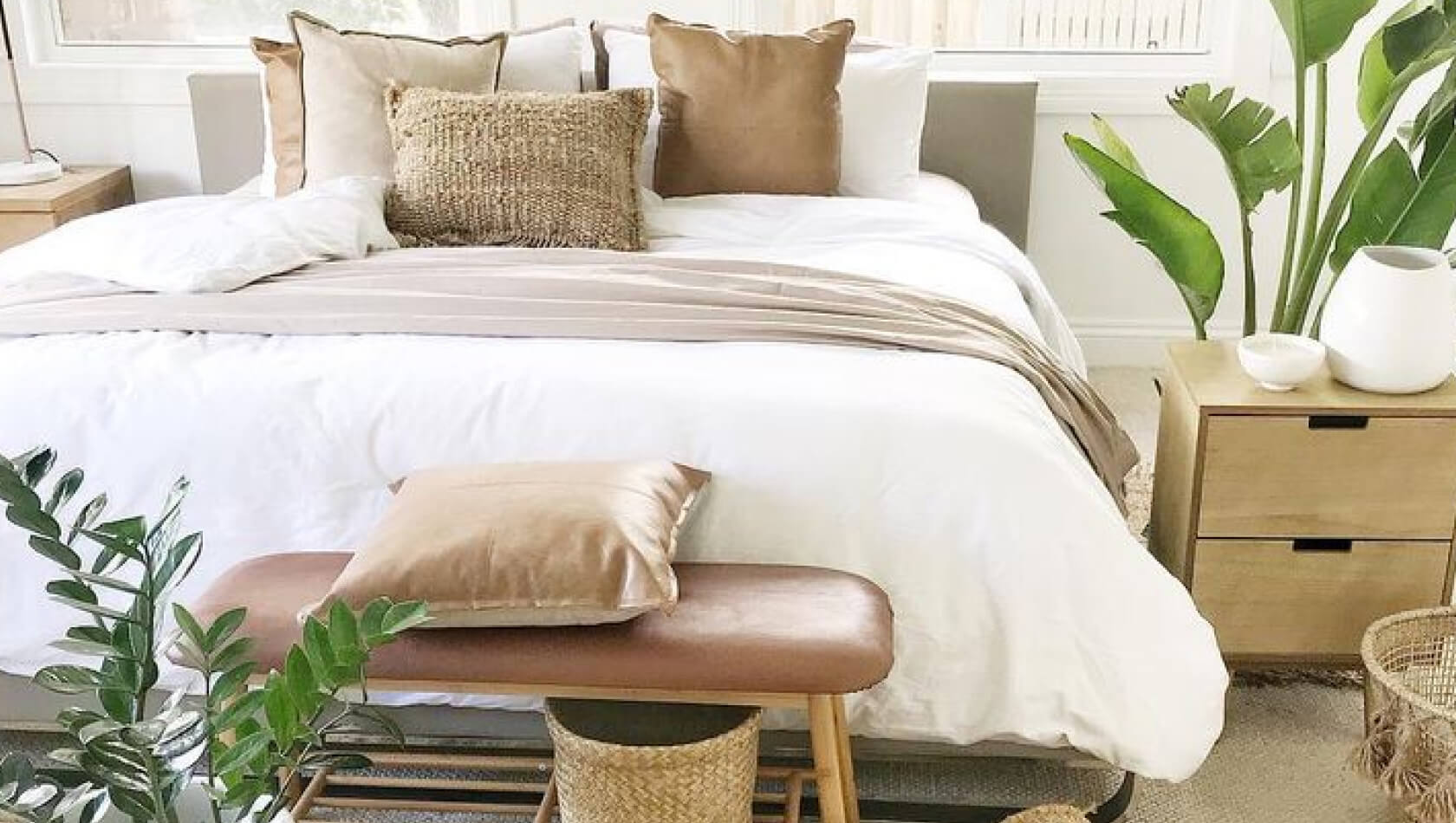 A bedroom with indoor plants