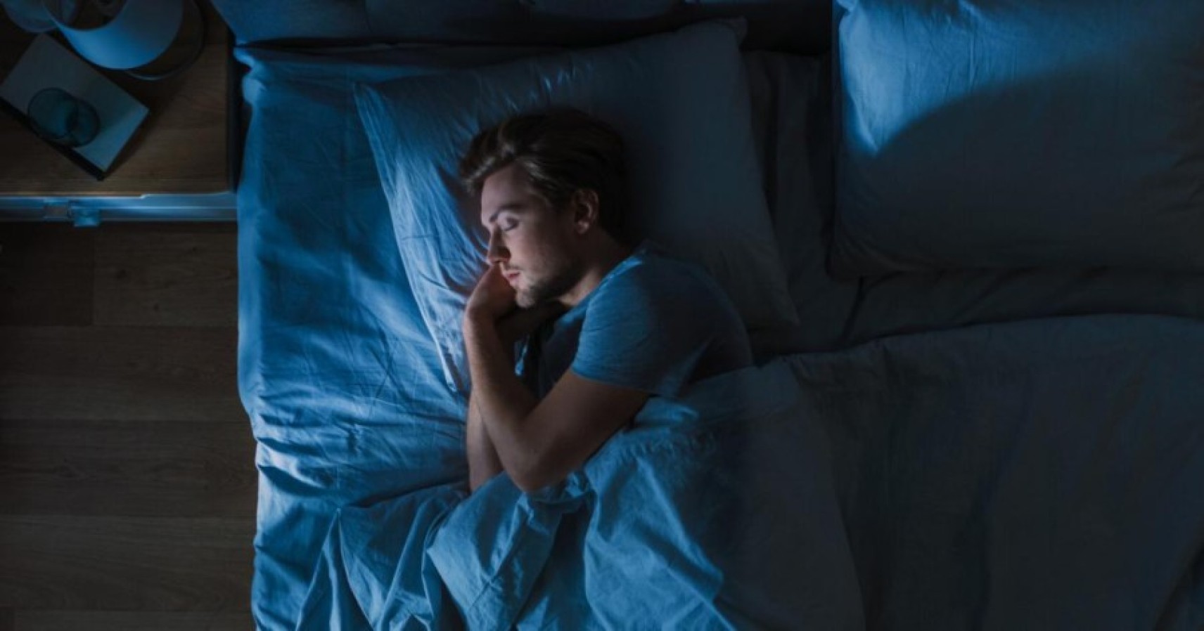 a person sleeping and a clock