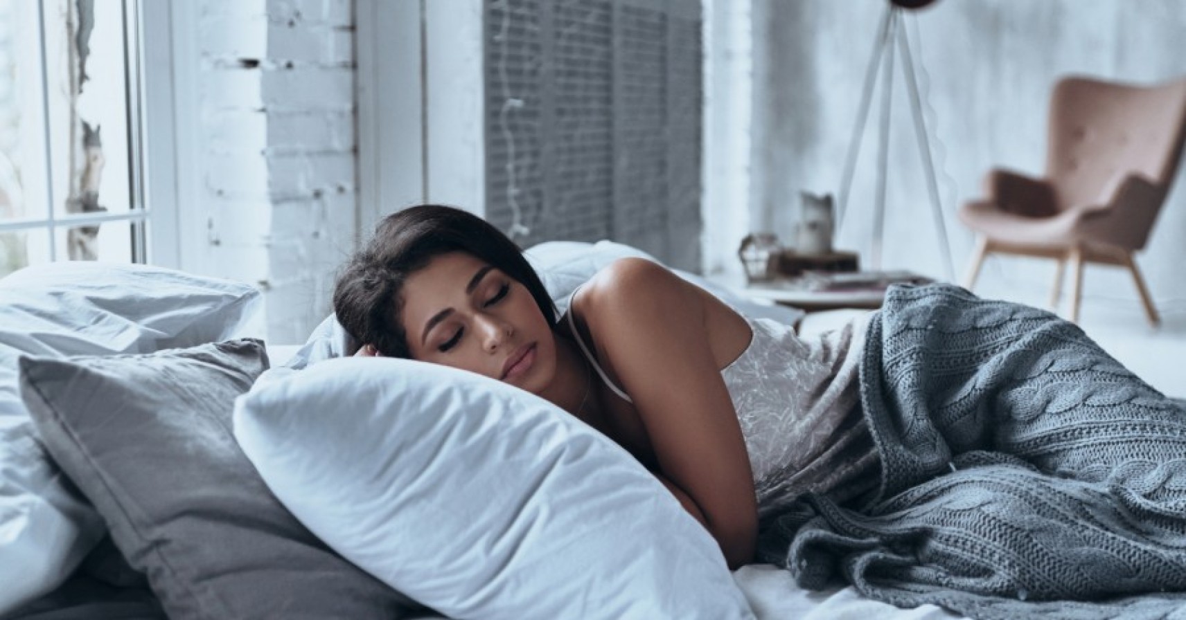 A person sleeping peacefully in a comfortable bed