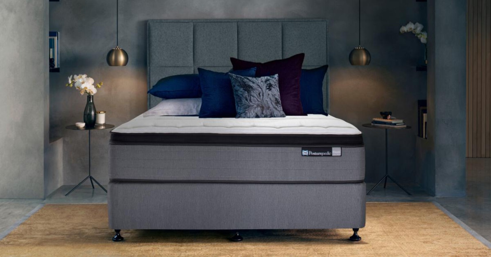Moody bedroom with dark grey upholstered bed